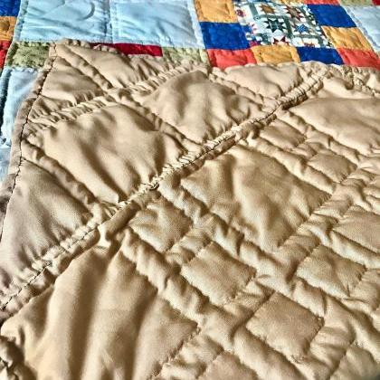 Beautiful hand stitched quilted bed..