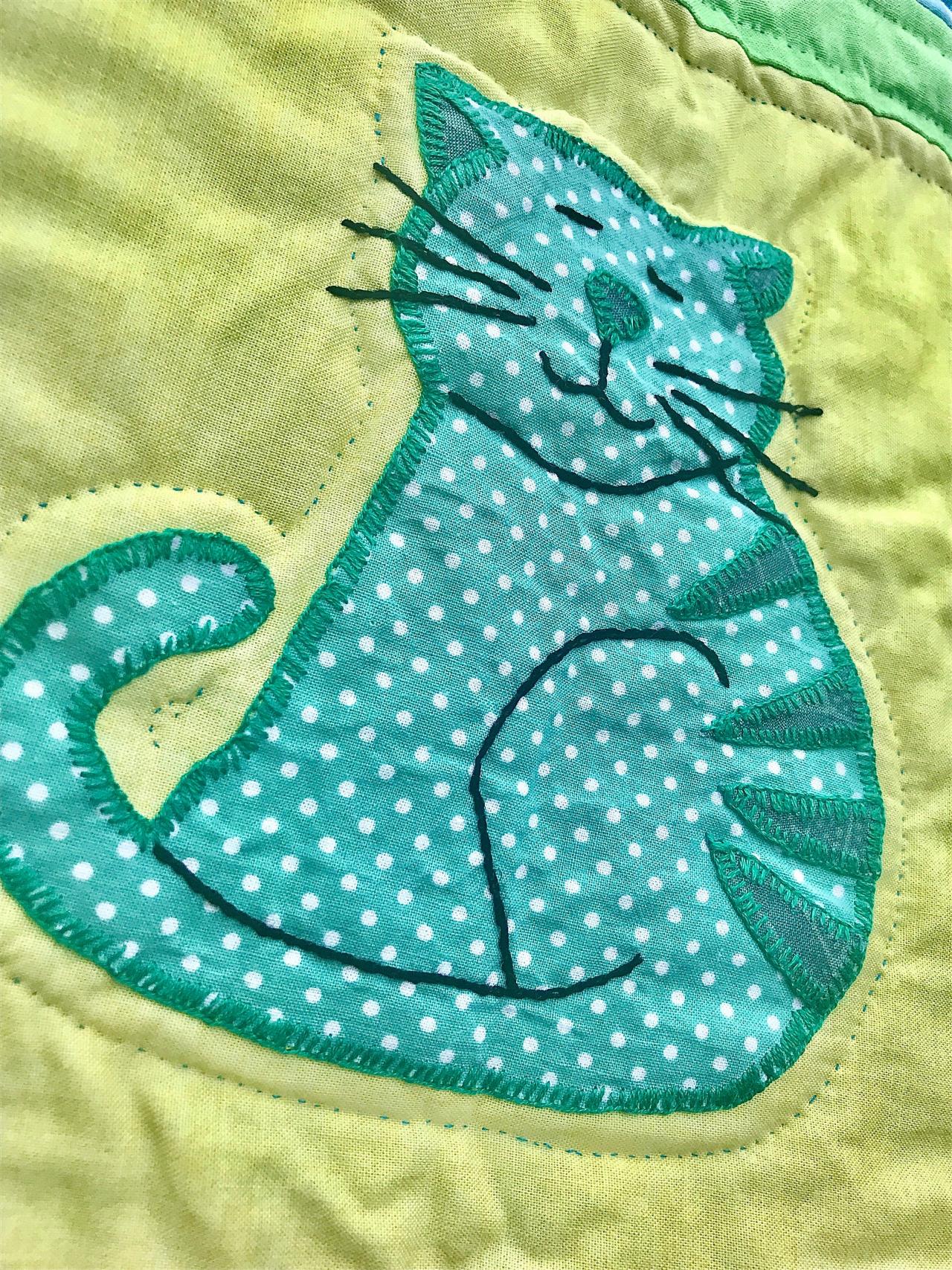 Cute hand stitched baby quilted cover or play mat.