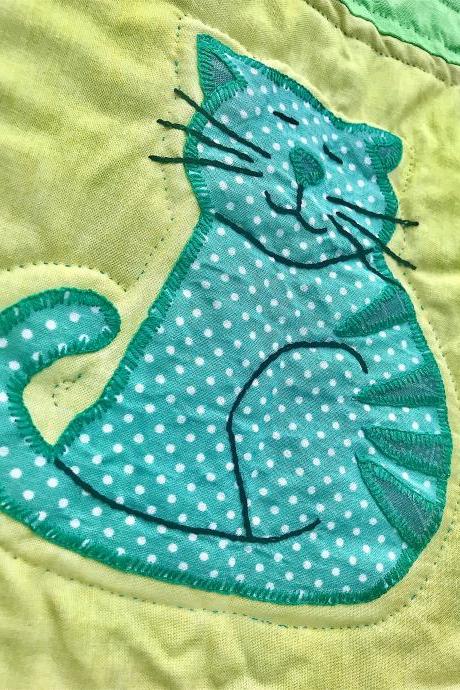 Cute hand stitched baby quilted cover or play mat.