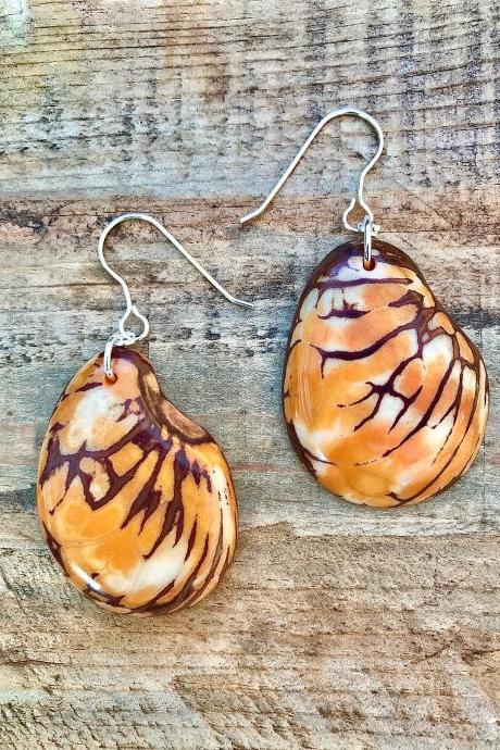 Orange cream brown Tagua nut (vegetable Ivory) dangle earrings with sterling silver wires.