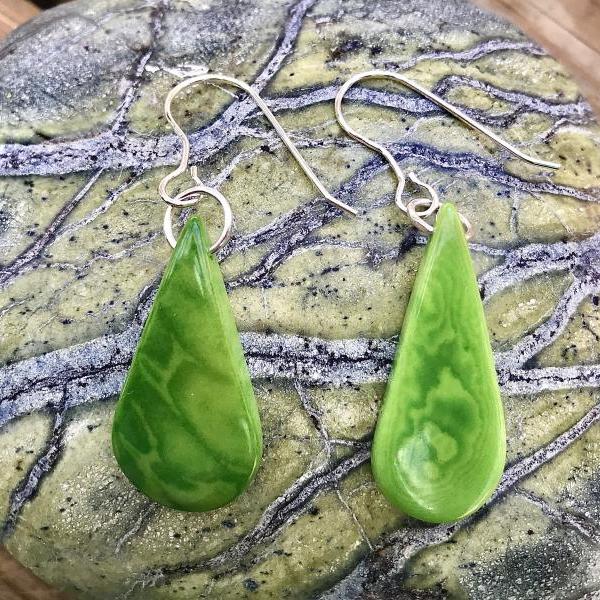 Beautiful grass green teardrop Tagua nut (vegetable Ivory) dangle earrings with sterling silver wires .